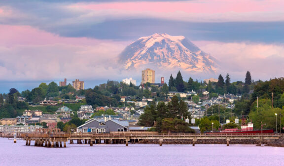 Mount Rainier over Tacoma Washington waterfront during alpenglow sunset evening